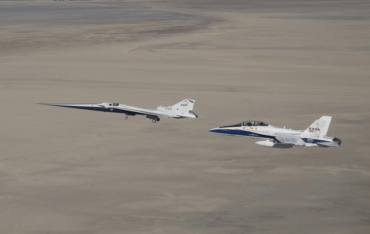 NASA aircraft flying over a desert test range, illustrating aerospace demand context